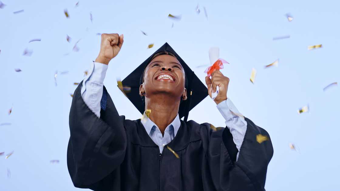 A student celebrating her graduation