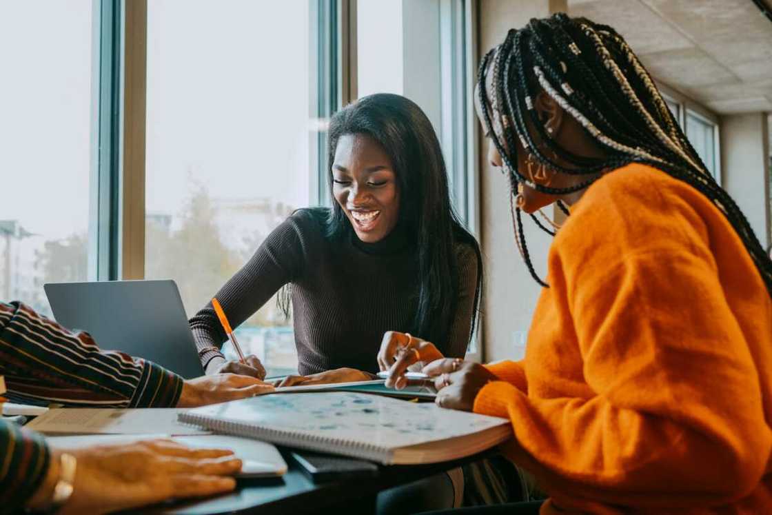 Female friends studying together