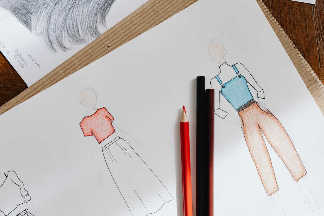 Sketches of clothes on a white paper