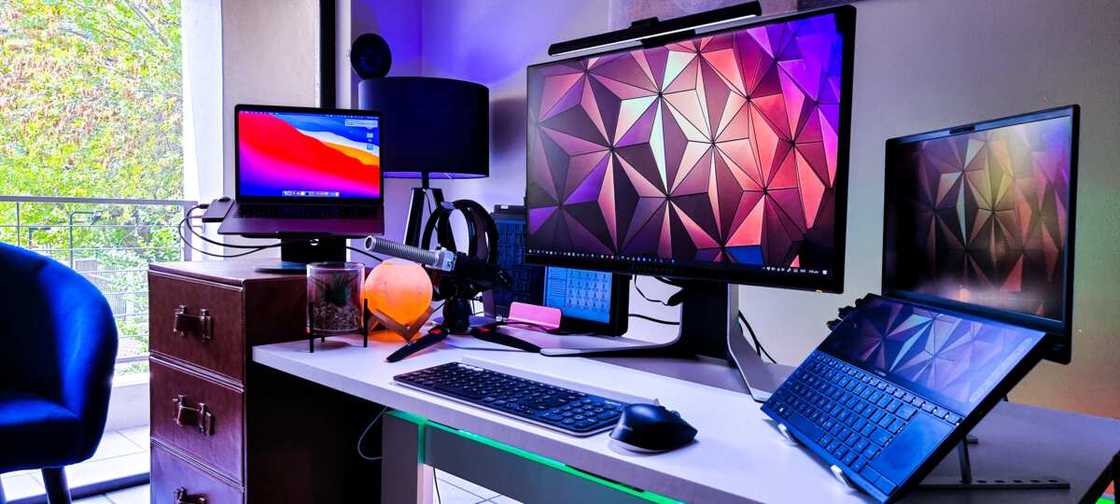 Several computers on a desk