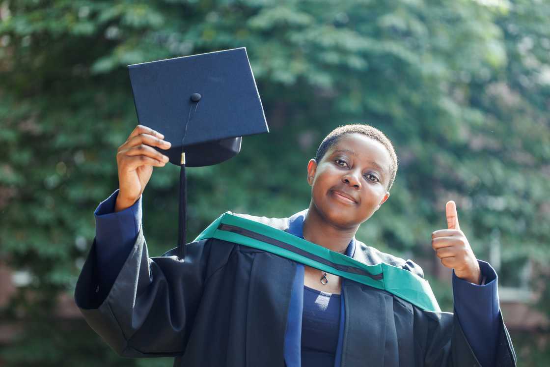 A student celebrates her graduation