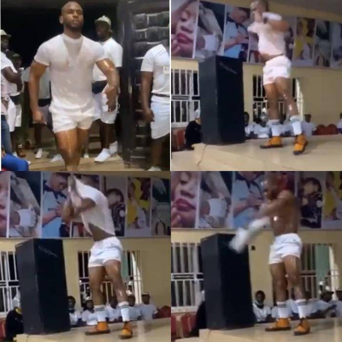 Crowd mocks Mr. macho contestant as he woefully fails to rip his shirt open during a contest (video)