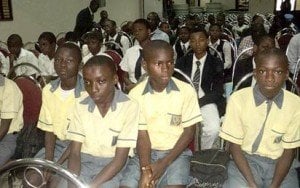 School children listening attentively to instructions just before the poster contest commenced