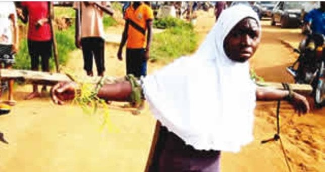 student tied to cross for coming late to school